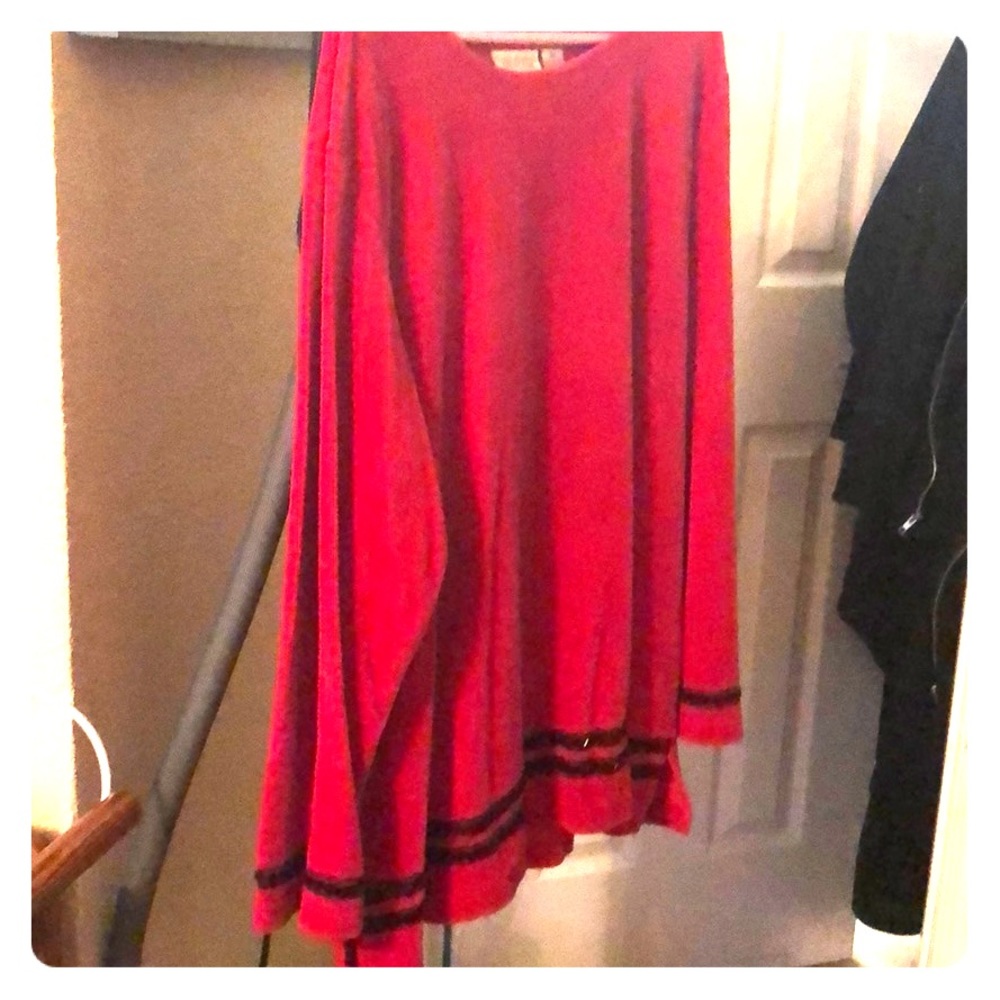 Red velvet tunic with black sequin trim.